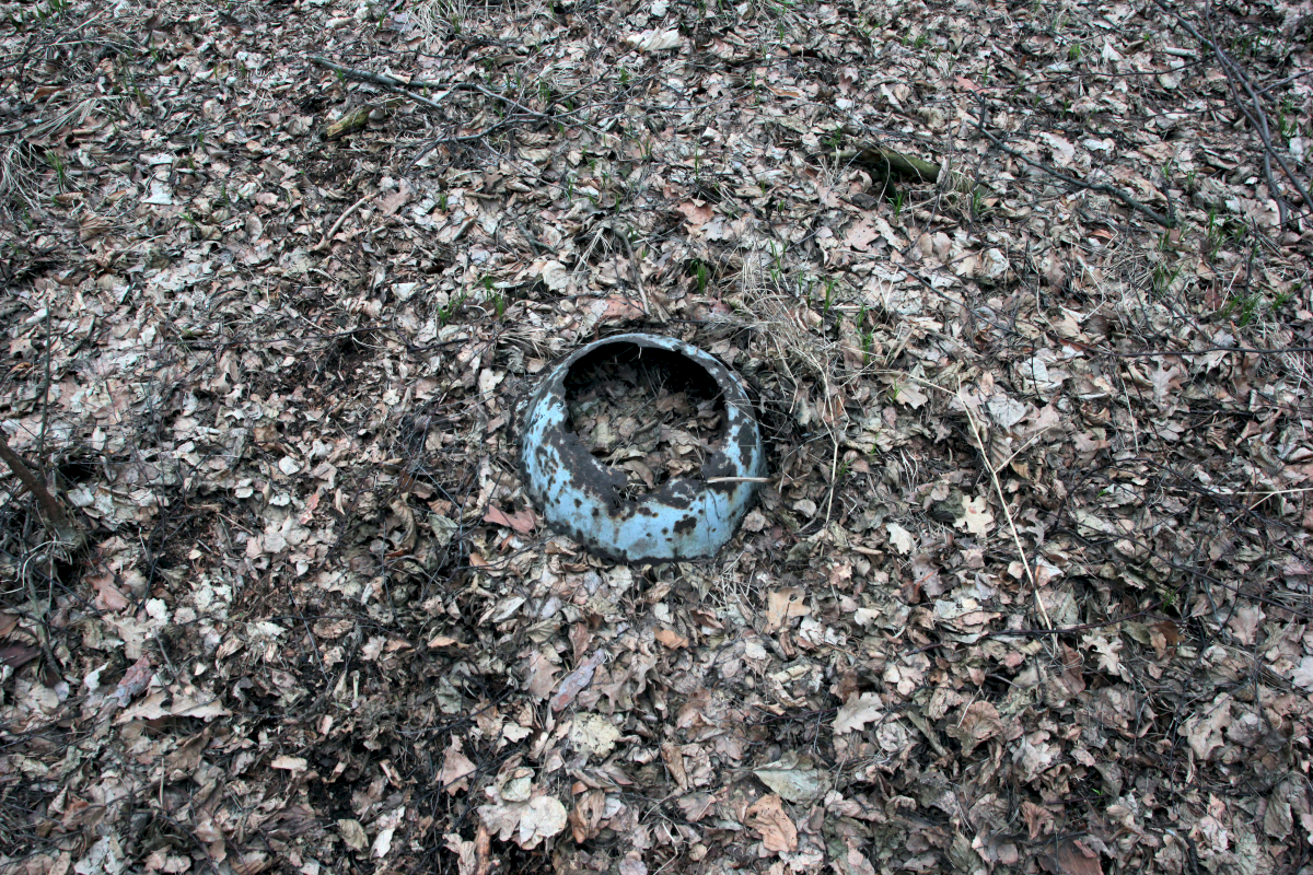 Historical objects can be found all over Auschwitz-Birkenau. This enamel pot lies in the forest north of crematories IV and V