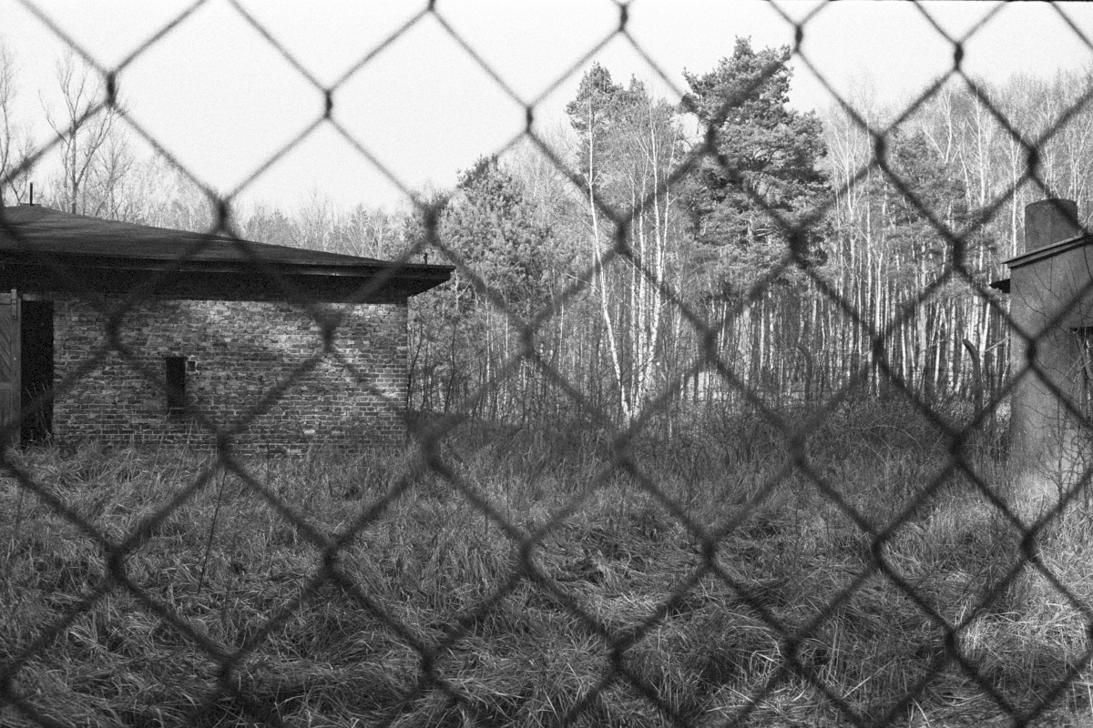 Outside the so-called "New Kitchen", a building located outside the camp. It was part of plans to enlarge the camp to hold over 100,000 prisoners. Today the building is close to collapse, fenced off and closed for the public.